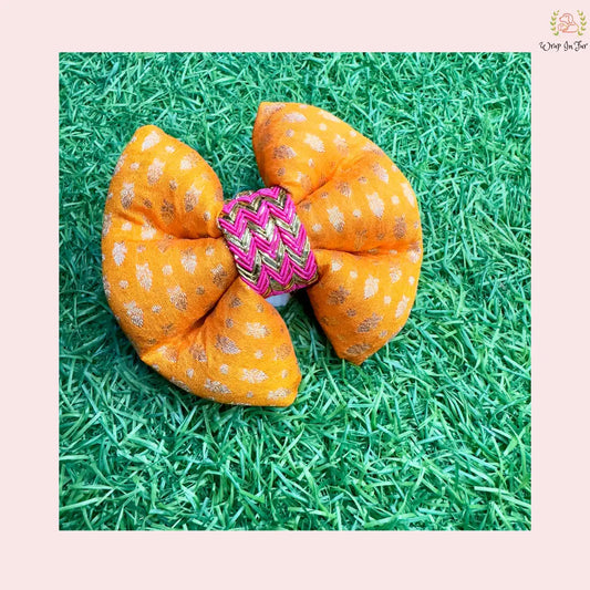 Orange festive dog bow for party and festivals